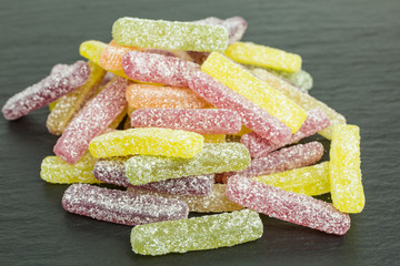 heap of colorful sour sugar gummy candy