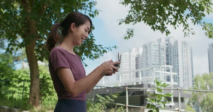 Woman control a fly drone at outdoor