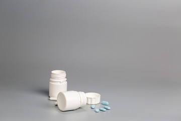 White plastic bottles of medicine and pills