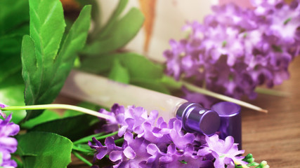 The clear luxury body perfume bottle spray and purple flower