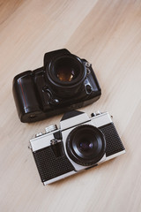 classic film cameras on a wooden background