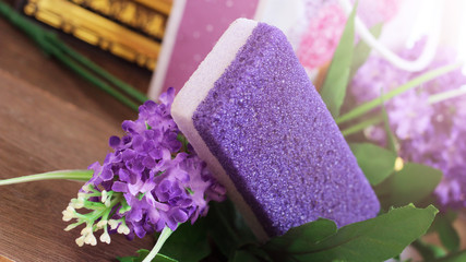 Obraz na płótnie Canvas Purple beautiful pumice and flowers, self-care