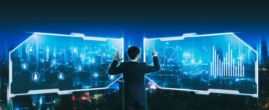 Business man using futuristic people network screen on night city technology background