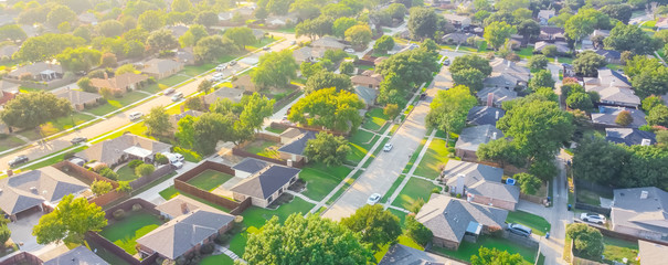 Panorama aerial view urban sprawl subdivision near Dallas, Texas, USA row of single family homes...