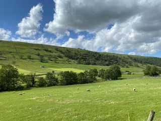 Landscape view, looking across fields, meadows, and hills, on a sunny day near, Kettlewell, Skipton, UK