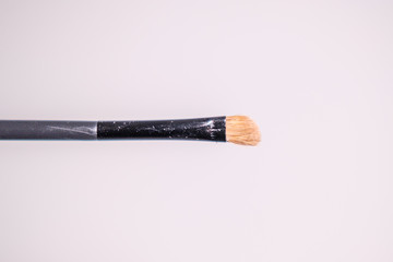 makeup equipment. Professional brushes. Color sample hands holding tools. Lip, shadows,blending, broncer tools