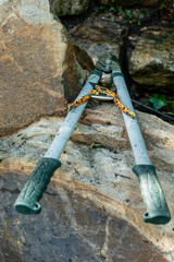 Large and small loppers placed on stones