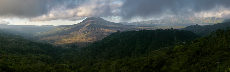 Obraz na płótnie Canvas panorama of high volcano with clouds on Bali island