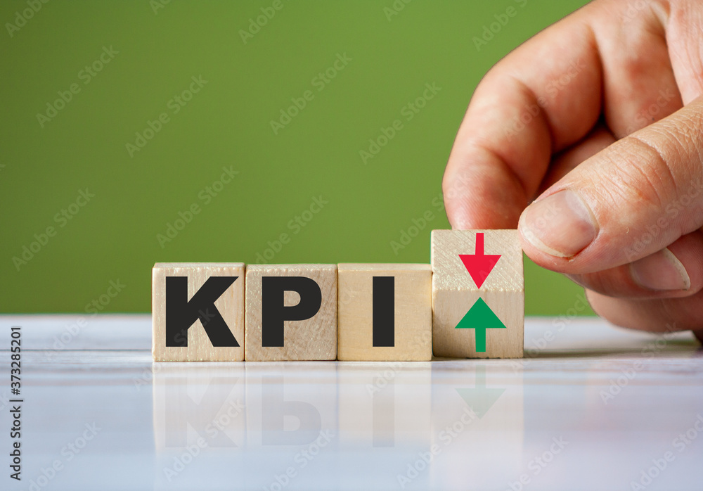 Poster the hand turn wooden block with red and green arrow as change concept of kpi. word kpi conceptual sy