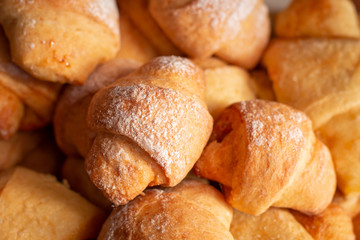 Many fresh tasty croissants in the bowl