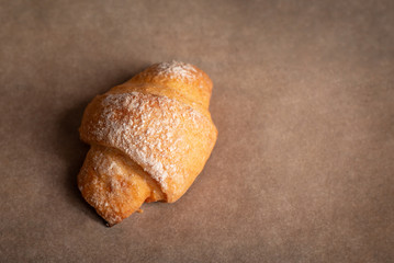 Homemade croissant on baking paper