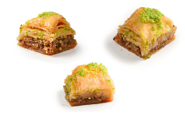 Pistachio baklava on a white background. Dessert.