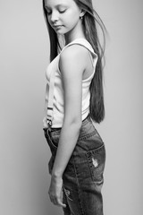 Fototapeta premium Beautiful child. Little girl in black and white studio. High quality photo.