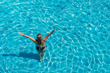 Fototapeta premium woman in luxury spa resort near the swimming pool.
