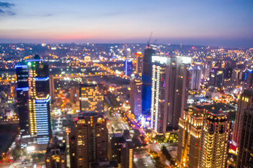 Fototapeta na wymiar background of city skyline at night in aerial view