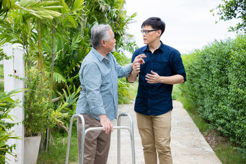 The old father is teaching and forbidding his son to interfere with smoking in the backyard. ...