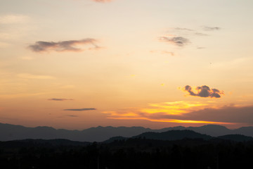 Land with and dramatic colorful sky at sunset