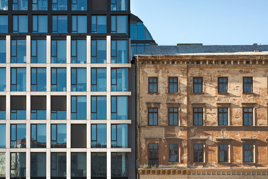 Front View of a Commercial Office and Apartment Building in the City Center, Typical Modern and Old Classic Architecture Side by Side