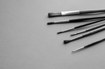 Set of random brushes for painting on  light gray textured background.