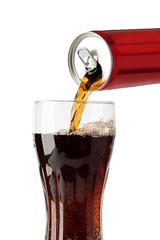pouring cola soda drink from can to glass