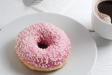 Pink donut and coffee