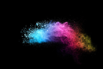 Explosion of colored powder isolated on black background. 