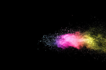 Explosion of colored powder isolated on black background. 