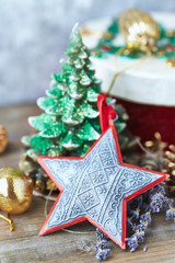 Christmas star on wooden background. Close up.