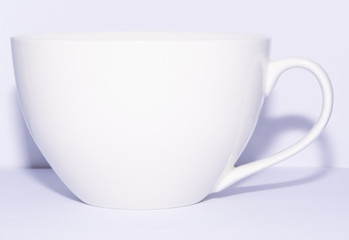 white cup on white background