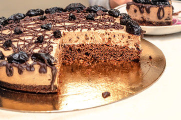 Homemade cake with chocolate cream and prunes