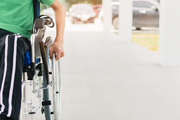 Asian special child on wheelchair wear green shirt learn how to use wheelchair on ramp for disabled people by trainer, Lifestyle in the education age of disability children, Physical Therapy concept.