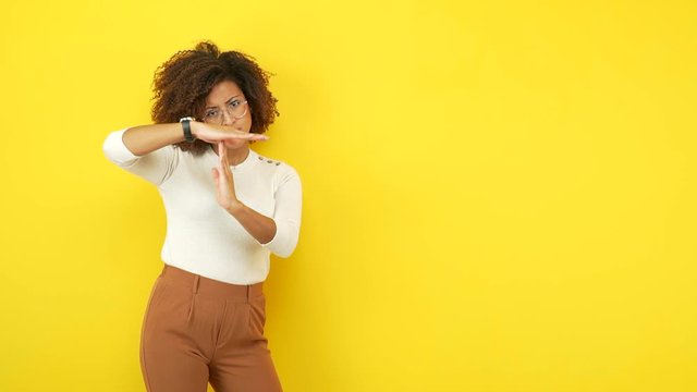 Young african american woman making a timeout gesture