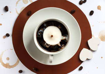 Cup of coffee with milk, top view