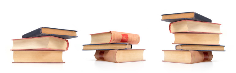 Stack of books in colour covers with white sheets isolated on a white background