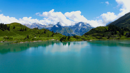 Flight over a wonderful mountain lake in the Swiss Alps - Lake Truebsee on Mount Titlis - travel photography