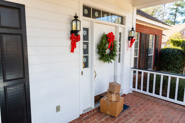 Packages on front porch of home during holiday season