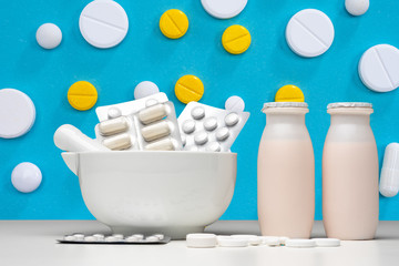 Probiotics bacteria. Table for manufacture of food additives. Food supplements with Probiotics bacteria. Medicine and probiotic bottles are side by side. Biologically active additives. Microorganisms