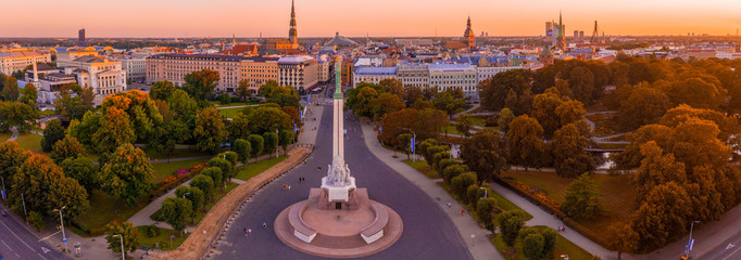 Amazing aerial view of the Statue of Liberty Milda in Riga, Latvia during sunset