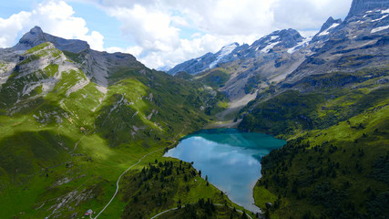 Naklejka na ściany i meble Popular vacation spot in the Swiss Alps - the Melchsee Frutt district in Switzerland - aerial view - travel photography