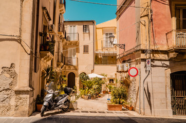 Traditional Italian houses with motorcycle in the Sicilian city of Syracusa