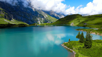 Naklejka na ściany i meble Wonderful colors of Switzerland - Flight over the Swiss Alps - travel photography