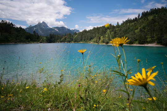 View over Urisee against cloudy sky in Reutte, Austria