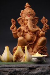 Modak- a traditional dish made on Ganpati festival in India. served with clarified butter. Ganesh...