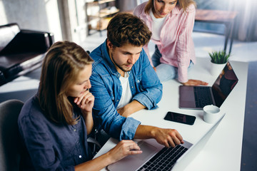 Group of young people working together. Creative business people in modern office