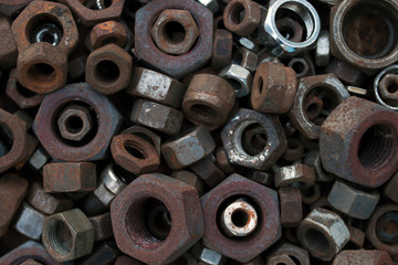 Lots of rusty nuts in bulk. Background image.