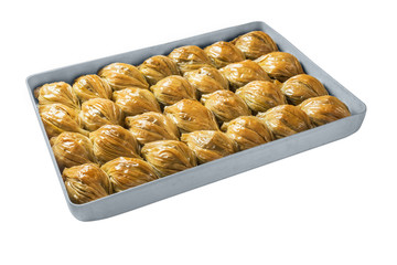 Turkish baklava, oriental sweets on a metal tray, isolated on white background. Horizontal format.
