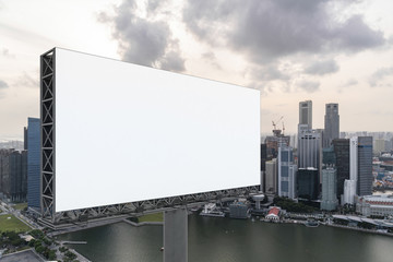 Blank white road billboard with Singapore cityscape background at sunset. Street advertising poster, mock up, 3D rendering. Side view. The concept of marketing communication to sell idea.