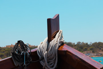 detail of a bow of a ship with ship stowage and an anchor