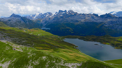 Naklejka na ściany i meble Flight over the wonderful nature of Switzerland - the Swiss Alps from above - travel photography