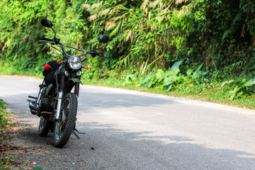 Fototapeta premium Vintage motorcycle at vietnamese road
